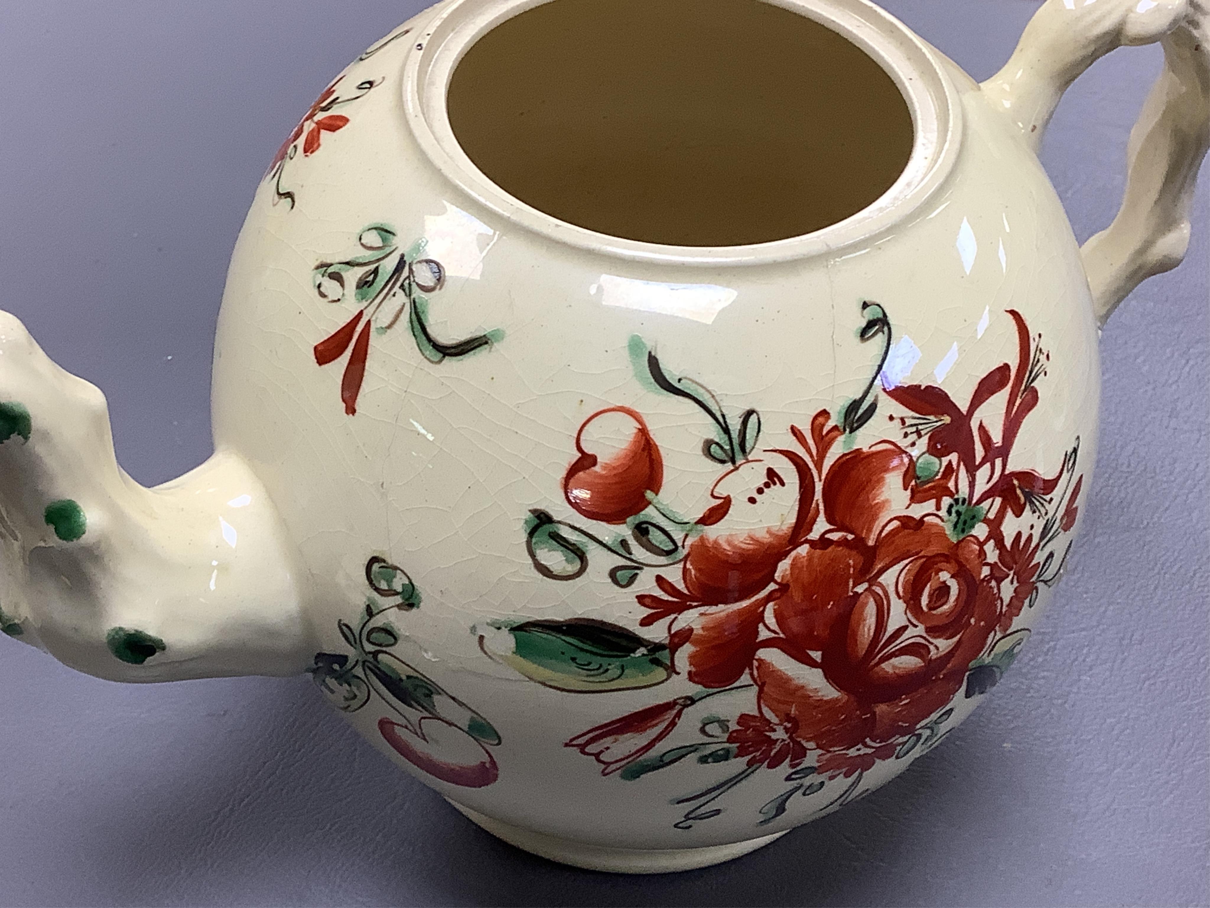 Two George III creamware teapots and a lidded sugar bowl, c.1780, largest 20cm wide
